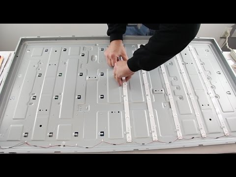 Technician repairing Hisense TV LED backlight in Dubai