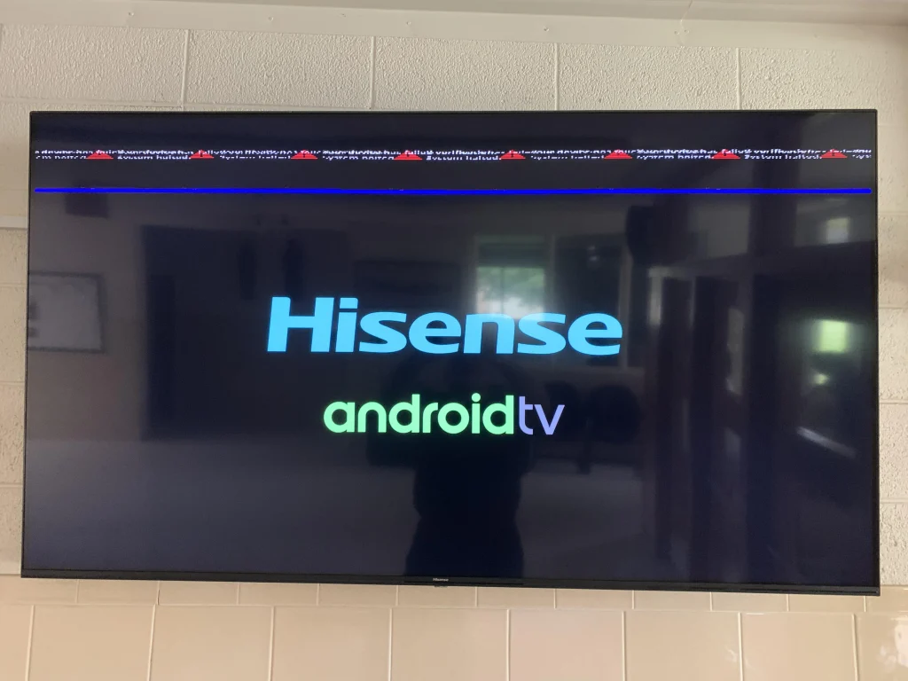 Technician repairing Hisense TV screen in Dubai

